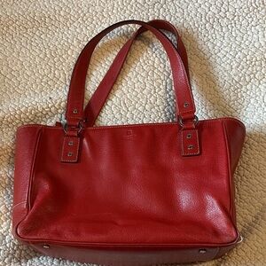 Classic red Vintage Kate Spade bag with lots of life left and silver accents.